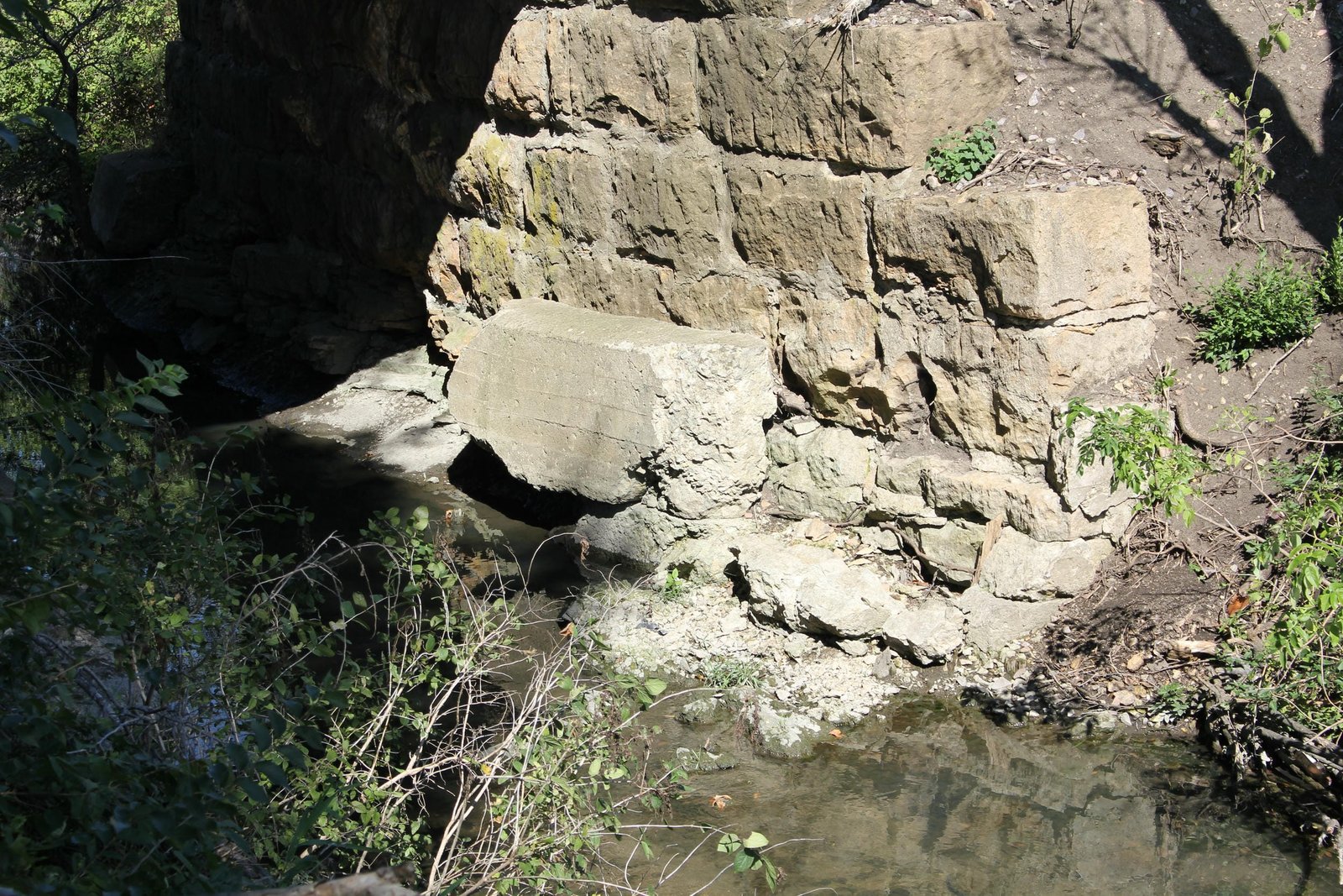 Failed concrete repairs on east abutment